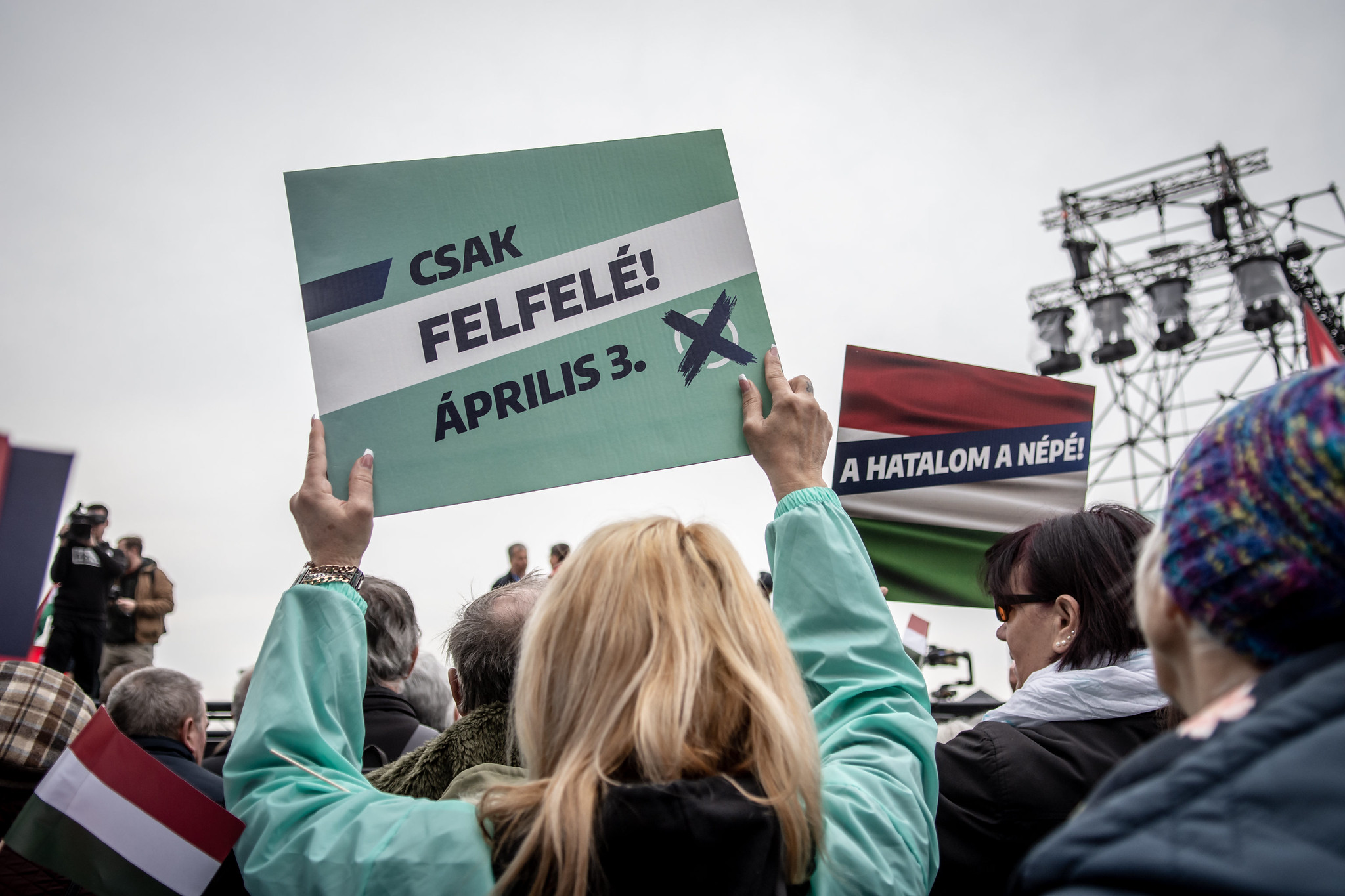 "Only upwards! - 3 April" - "The nation has the power" signs on the opposition rally of 15 March in Budapest people holding up campaign signs on the opposition rally of 15 March in Budapest