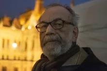 a portrait of Gáspár Miklós Tamás, taken at a protest for academic freedom in 2018
