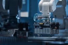 Automotive Battery Module On Automated Production Line With Robot Arms and Conveyor Belt. Electric Car Battery Pack Manufacturing Process. Modern EV Factory.