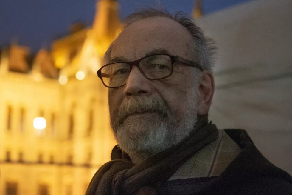 a portrait of Gáspár Miklós Tamás, taken at a protest for academic freedom in 2018